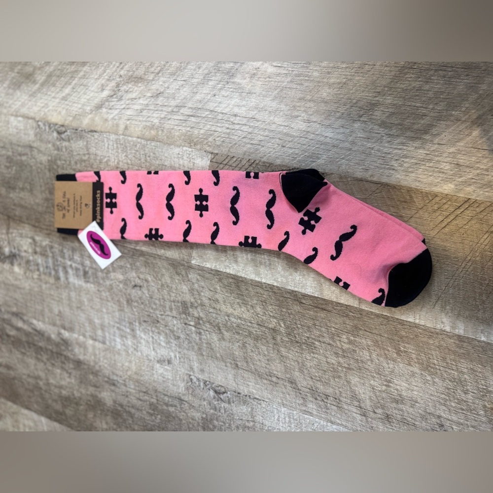 PINK SOCKS one size, pink with black mustache and puzzle piece pattern NWT